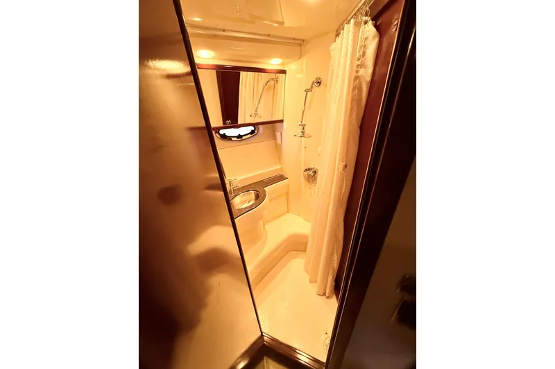 Slide: The Image of Bathroom interior of 2011 Meridian 391 Sedan yacht, featuring shower and sink. - 32