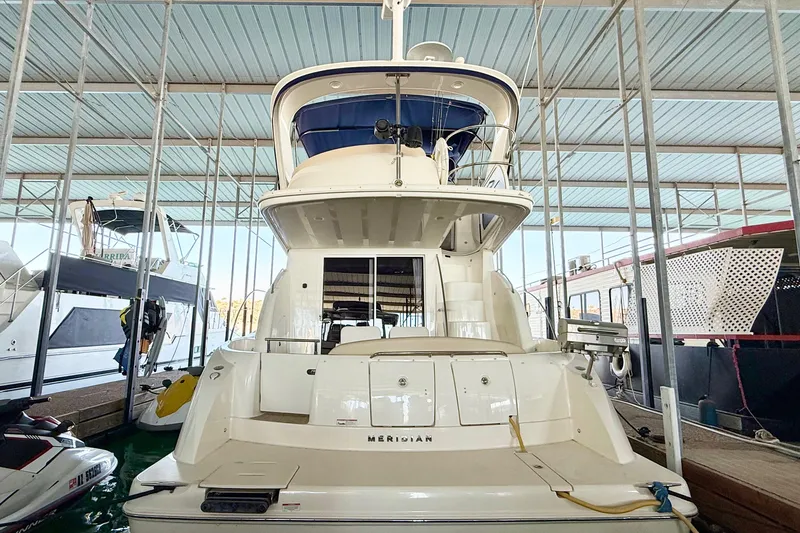 Slide: The Image of 2011 Meridian 391 Sedan yacht docked in a covered marina. - 4