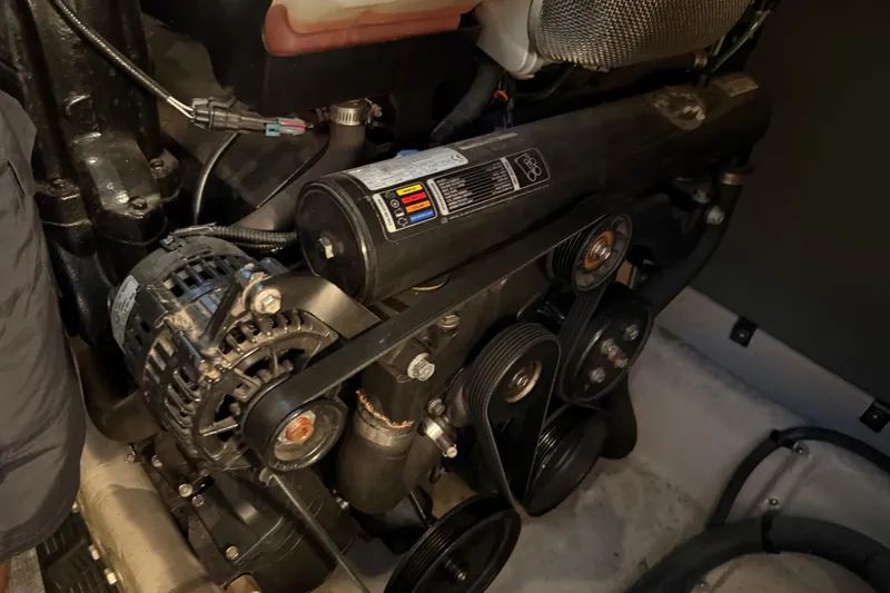 Slide: The Image of Engine compartment of a 2011 Meridian 391 Sedan, showcasing belts and components. - 41