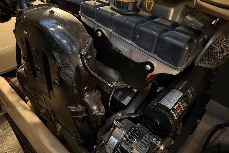 Slide: The Image of Engine compartment of a 2011 Meridian 391 Sedan boat, showcasing mechanical components. - 43