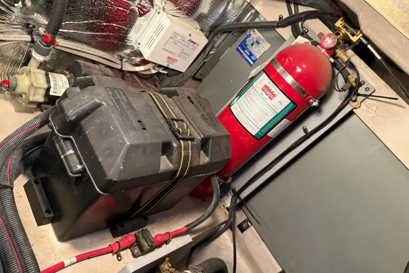 Slide: The Image of Engine room of 2011 Meridian 391 Sedan with fire extinguisher and battery box. - 45