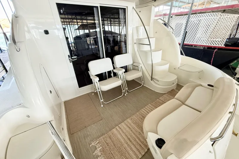 Slide: The Image of 2011 Meridian 391 Sedan yacht interior with seating, stairs, and sliding glass door. - 5