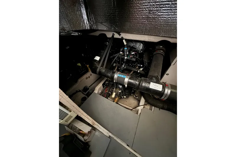 Slide: The Image of Engine compartment of a 2011 Meridian 391 Sedan boat, showcasing mechanical components. - 52