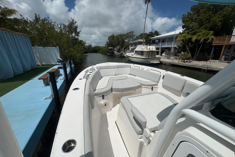 Slide: The Image of 2021 Sea Fox 268 Commander boat docked in a scenic canal setting. - 5