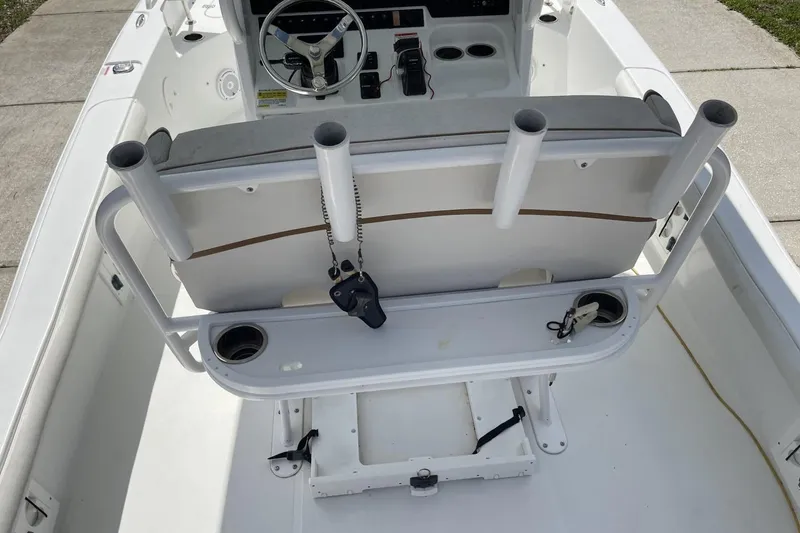 Slide: The Image of 2020 Sea Hunt BX 25 FS boat interior with rod holders and steering console. - 20