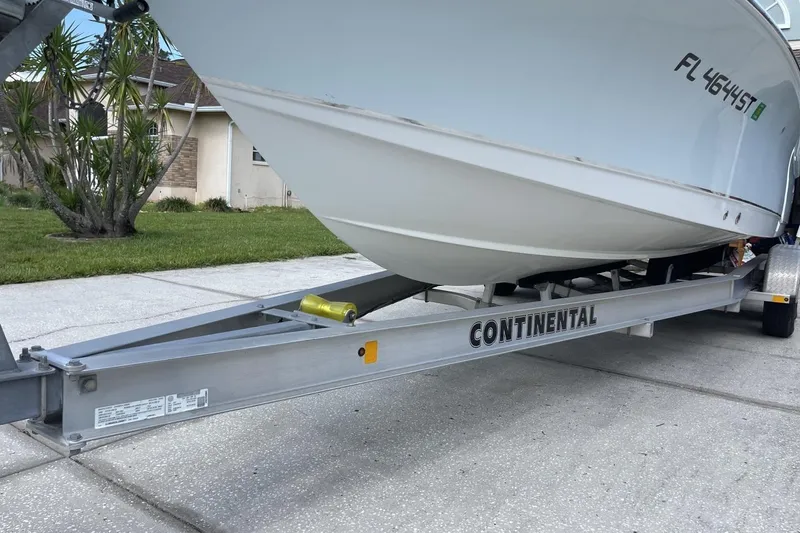 Slide: The Image of 2020 Sea Hunt BX 25 FS boat on Continental trailer, parked in driveway. - 29