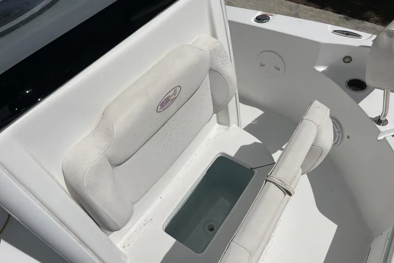 Slide: The Image of 2020 Sea Hunt BX 25 FS boat seating area with storage compartment. - 34