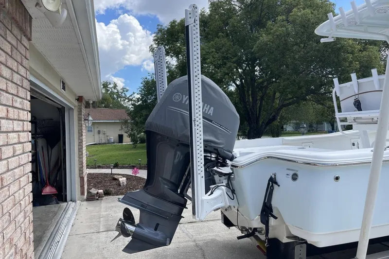 Slide: The Image of 2020 Sea Hunt BX 25 FS boat with Yamaha outboard motor in driveway setting. - 4