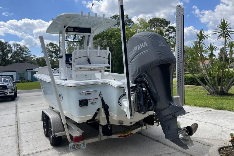 Slide: The Image of 2020 Sea Hunt BX 25 FS boat with Yamaha engine on trailer, parked in driveway. - 7