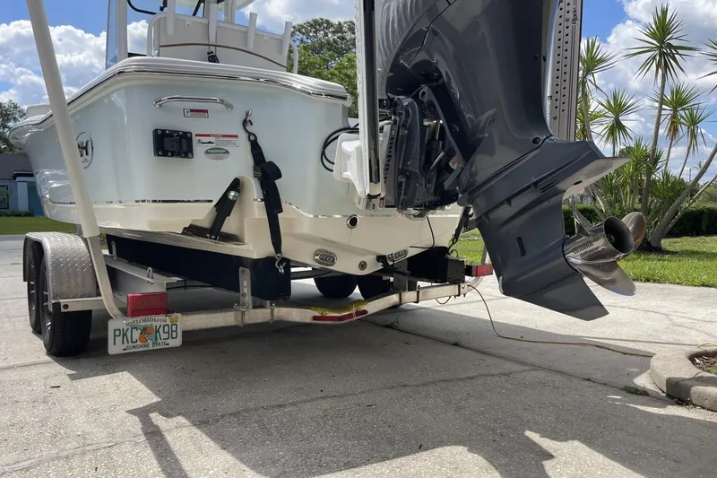 Slide: The Image of 2020 Sea Hunt BX 25 FS boat on trailer, rear view with outboard motor. - 8