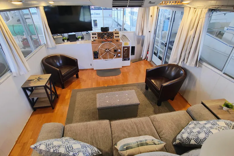 Slide: The Image of Luxurious interior of a 1988 Gibson 50 Standard yacht with modern furnishings and helm station. - 20