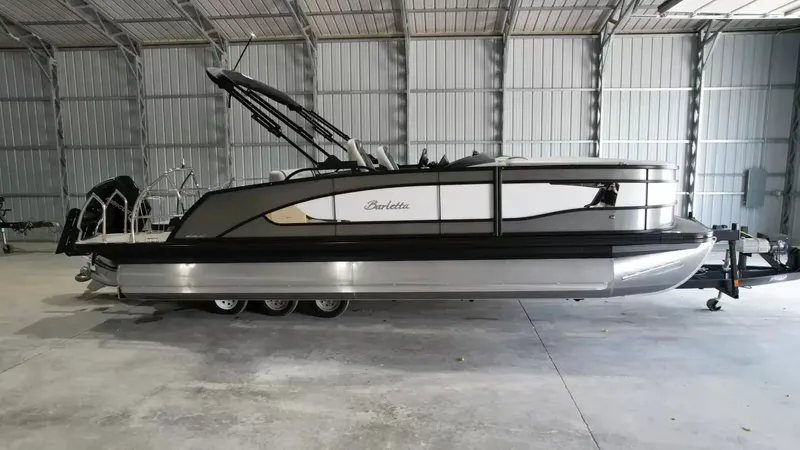 The Image of 2026 Barletta Lusso L23UC pontoon boat in storage facility. - 1