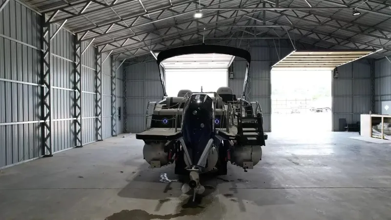 Slide: The Image of 2026 Barletta Lusso L23UC pontoon boat in storage facility. - 10
