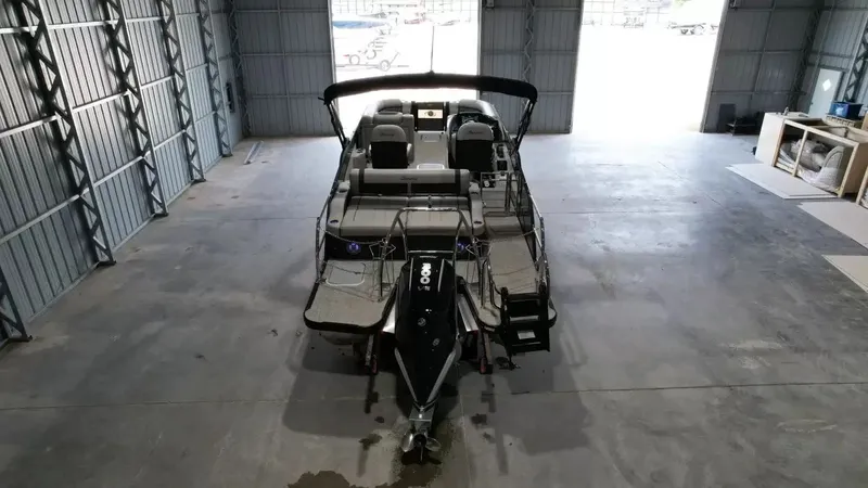 Slide: The Image of 2026 Barletta Lusso L23UC pontoon boat in storage facility. - 13
