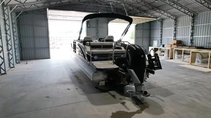 Slide: The Image of 2026 Barletta Lusso L23UC pontoon boat in storage facility. - 14