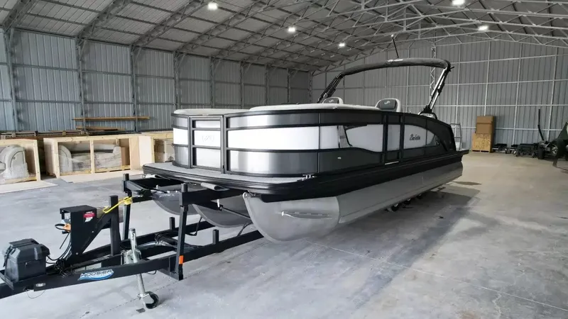 Slide: The Image of 2026 Barletta Lusso L23UC pontoon boat in storage facility. - 16