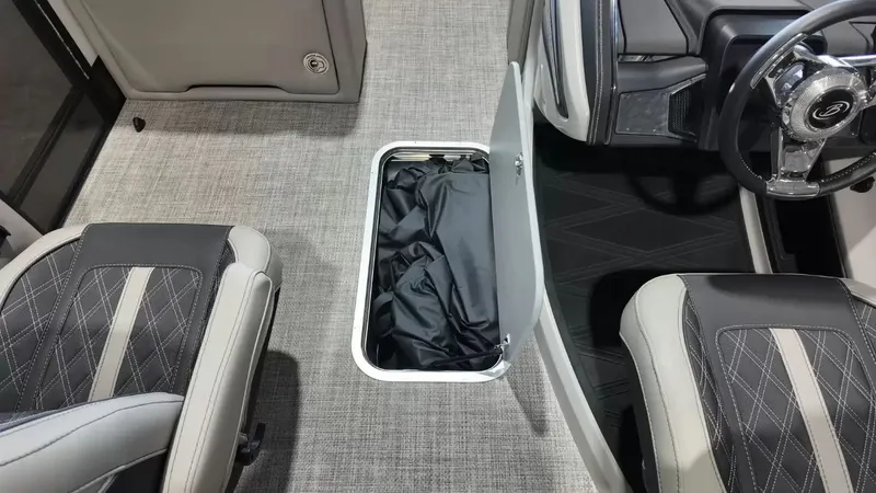 Slide: The Image of 2026 Barletta Lusso L23UC interior with storage compartment and steering wheel. - 36