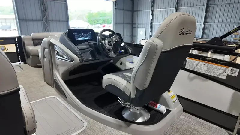 Slide: The Image of Interior of 2026 Barletta Lusso L23UC with modern helm station. - 37