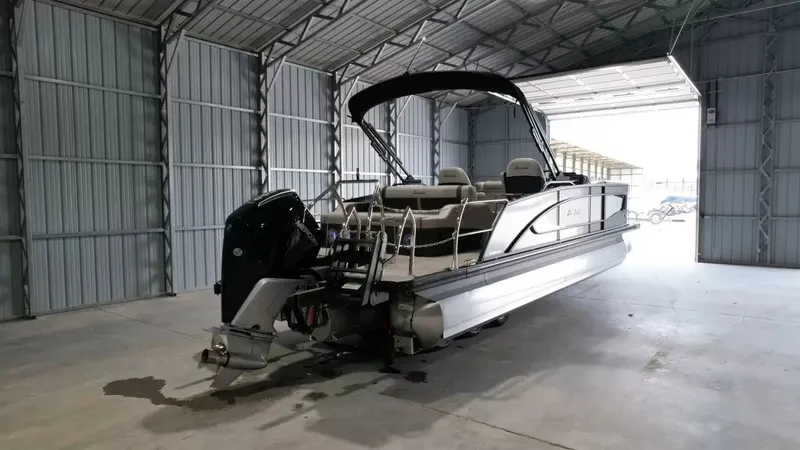 Slide: The Image of 2026 Barletta Lusso L23UC pontoon boat in storage facility. - 4