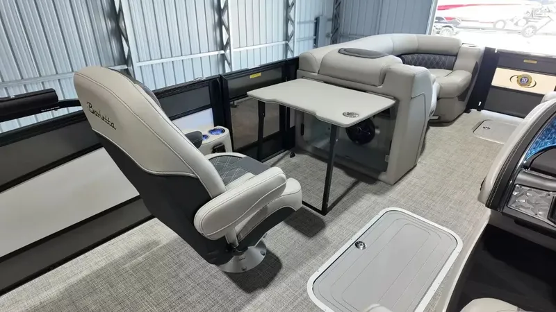 Slide: The Image of Interior of 2026 Barletta Lusso L23UC with luxurious seating and table. - 48