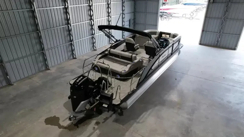 Slide: The Image of 2026 Barletta Lusso L23UC pontoon boat in storage facility. - 6