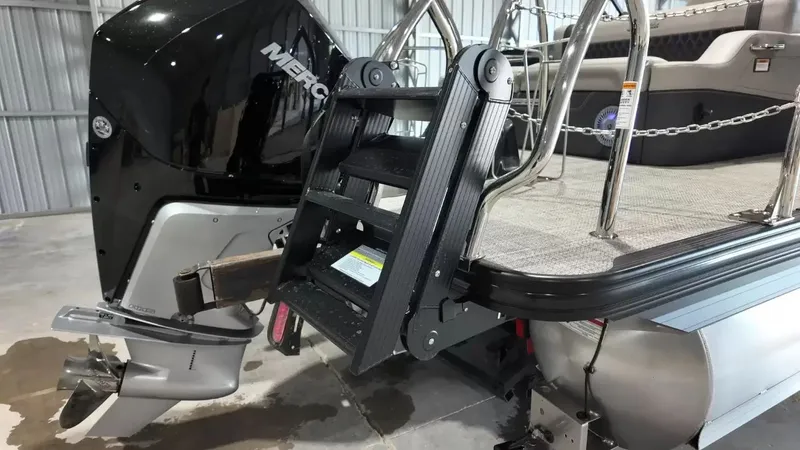 Slide: The Image of 2026 Barletta Lusso L23UC with outboard motor and ladder. - 7
