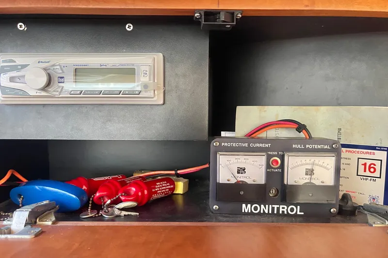 Slide: The Image of Control panel of a 1995 Silverton 36 Convertible boat with gauges and keys. - 19