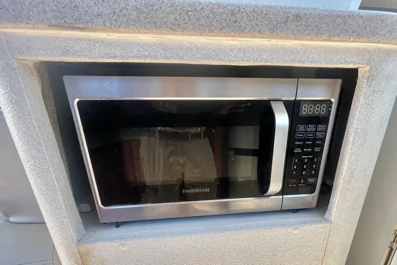 Slide: The Image of Built-in Farberware microwave in a 1995 Silverton 36 Convertible yacht kitchen. - 20