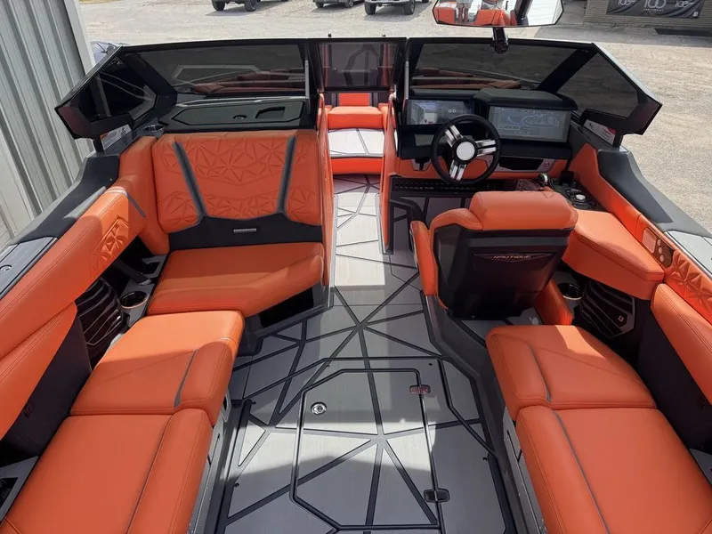 Slide: The Image of Interior of 2026 Nautique Super Air Nautique G25 Paragon with orange seating. - 10