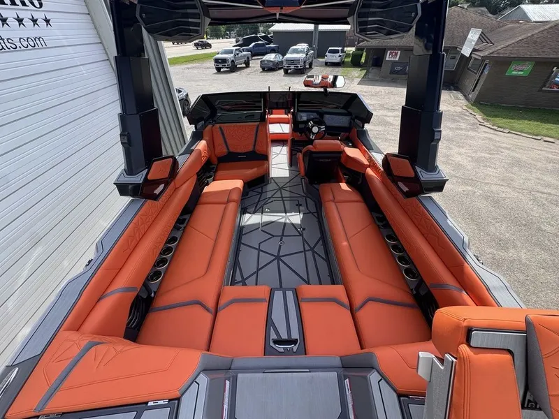 Slide: The Image of Interior of 2026 Nautique Super Air Nautique G25 Paragon with orange seating. - 4