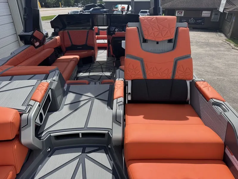 Slide: The Image of Interior of 2026 Nautique Super Air Nautique G25 Paragon with orange seating. - 5