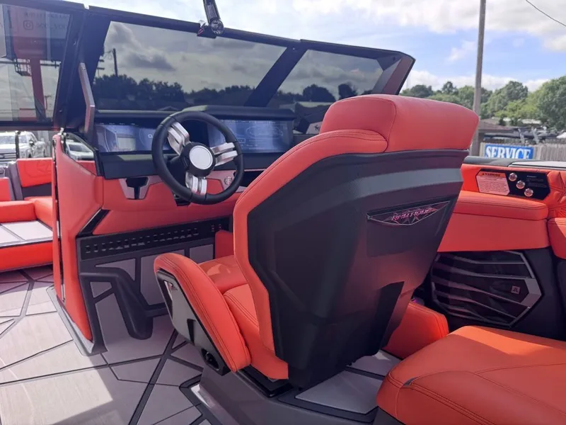 Slide: The Image of Interior of 2026 Nautique Super Air Nautique G25 Paragon with red seating. - 6