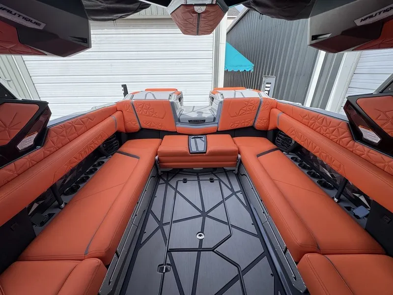 Slide: The Image of Interior of 2026 Nautique Super Air Nautique G25 Paragon with orange seating. - 8