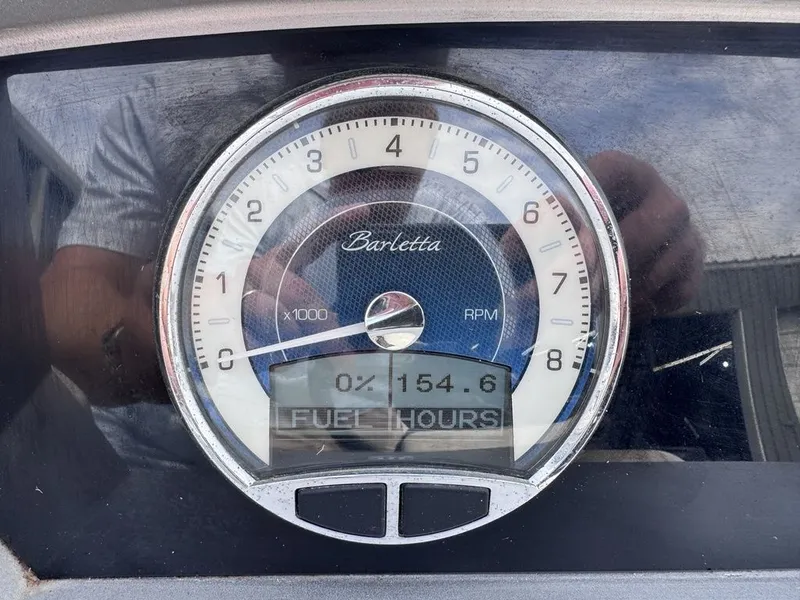Slide: The Image of Barletta 23UC boat tachometer displaying 154.6 fuel hours. - 11