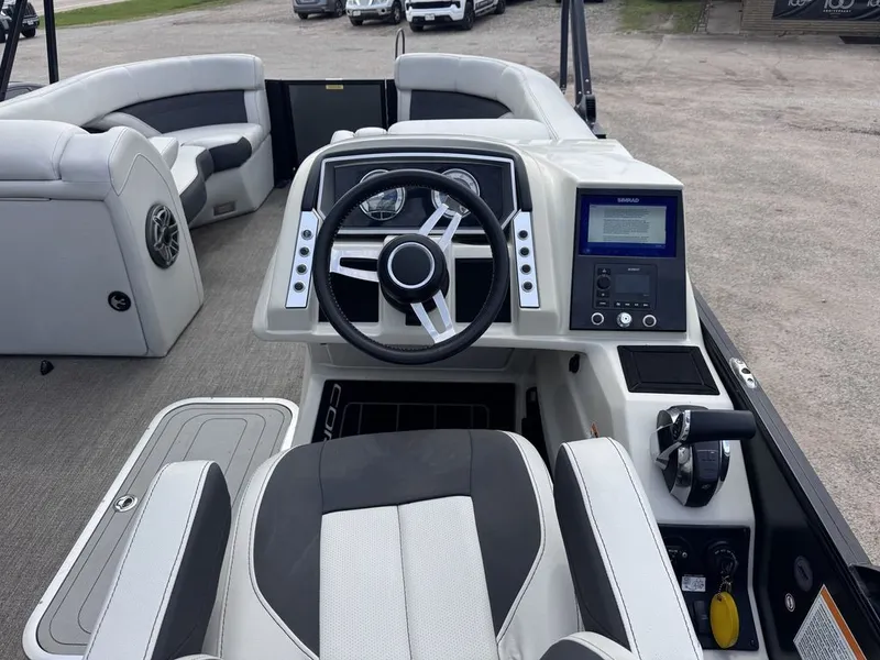 Slide: The Image of Interior of a 2021 Barletta Boats 23UC with steering console. - 4