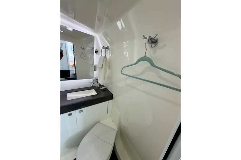 Slide: The Image of Modern bathroom interior of 2023 Aviara AV40 OB boat, featuring sleek design and amenities. - 10