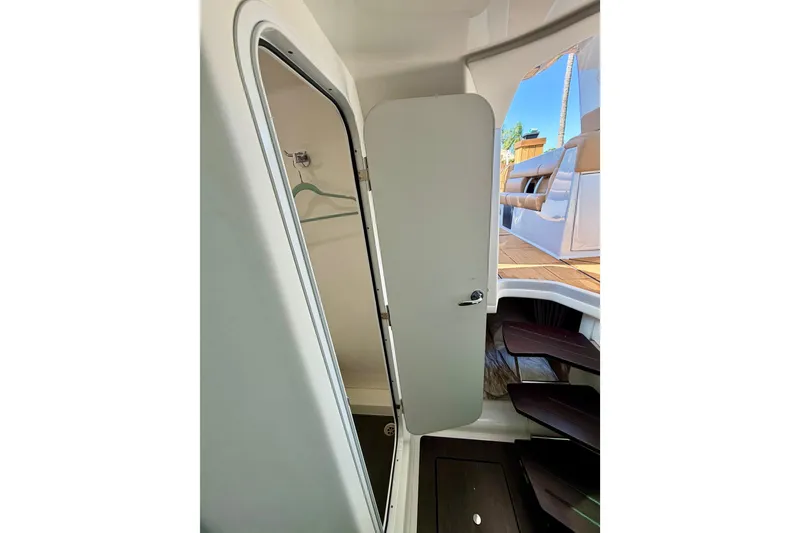 Slide: The Image of Interior view of 2023 Aviara AV40 OB boat, featuring a sleek cabin entrance. - 11