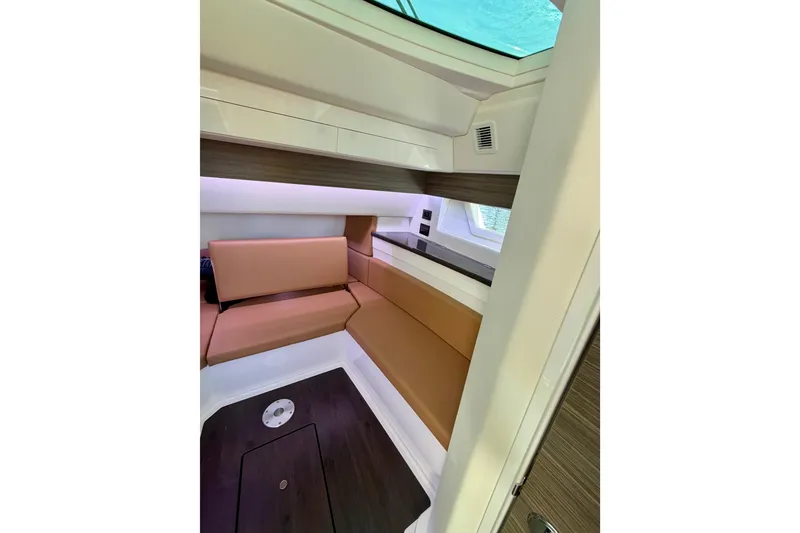 Slide: The Image of 2023 Aviara AV40 OB cabin interior with modern seating and sleek design. - 14