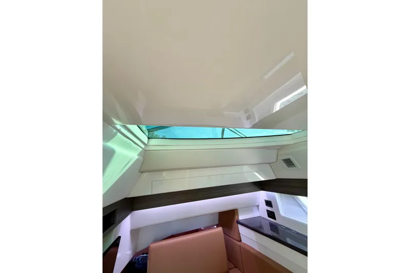 Slide: The Image of Interior view of 2023 Aviara AV40 OB boat cabin with modern design elements. - 16