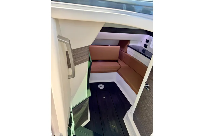 Slide: The Image of Interior cabin of 2023 Aviara AV40 OB boat with brown seating and modern design. - 17