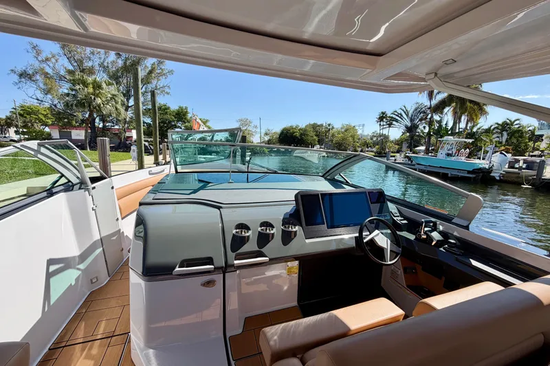 Slide: The Image of 2023 Aviara AV40 OB boat interior with modern dashboard and waterfront view. - 20