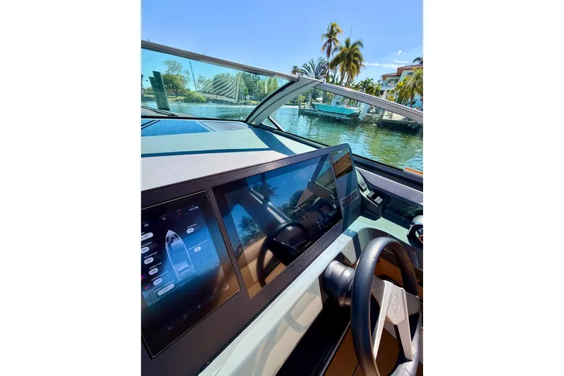 Slide: The Image of Cockpit view of 2023 Aviara AV40 OB boat with digital display and steering wheel. - 22