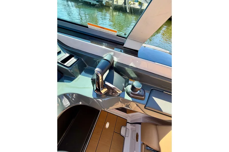 Slide: The Image of 2023 Aviara AV40 OB boat helm with modern controls and sleek design. - 24