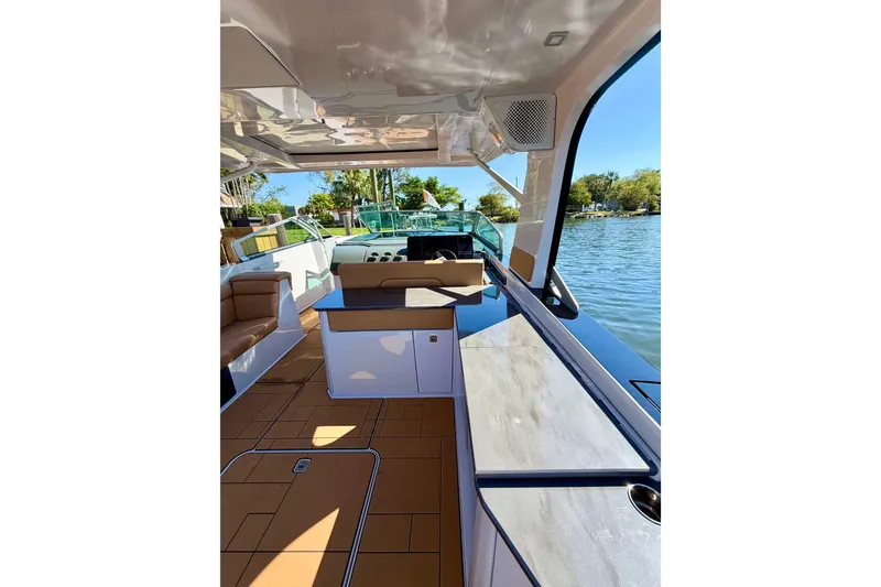 Slide: The Image of Luxurious 2023 Aviara AV40 OB boat interior with sleek design and waterfront view. - 29