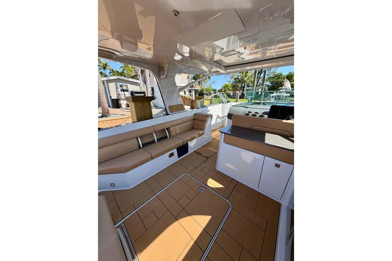 Slide: The Image of Luxurious interior of 2023 Aviara AV40 OB boat with tan seating and modern design. - 30