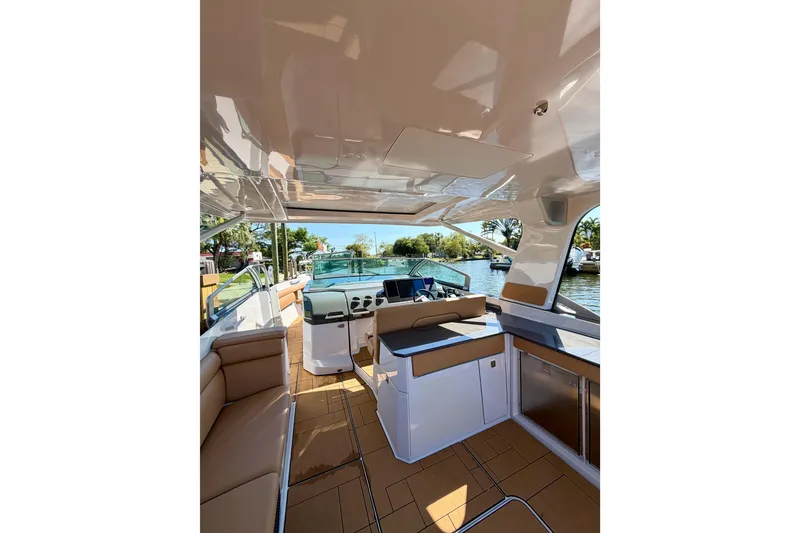 Slide: The Image of Luxurious interior of 2023 Aviara AV40 OB boat with modern seating and helm. - 34