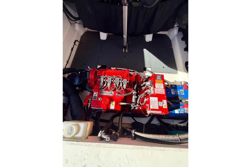 Slide: The Image of Engine compartment of 2023 Aviara AV40 OB boat, featuring red engine components and wiring. - 36