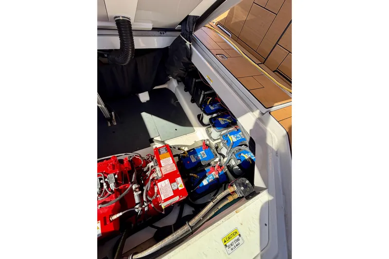 Slide: The Image of 2023 Aviara AV40 OB boat engine compartment with batteries and wiring. - 37