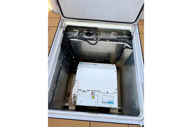 Slide: The Image of 2023 Aviara AV40 OB engine compartment with visible machinery and wiring. - 4