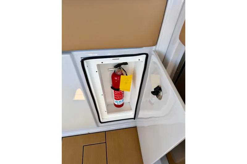 Slide: The Image of Fire extinguisher in compartment of 2023 Aviara AV40 OB boat. - 9